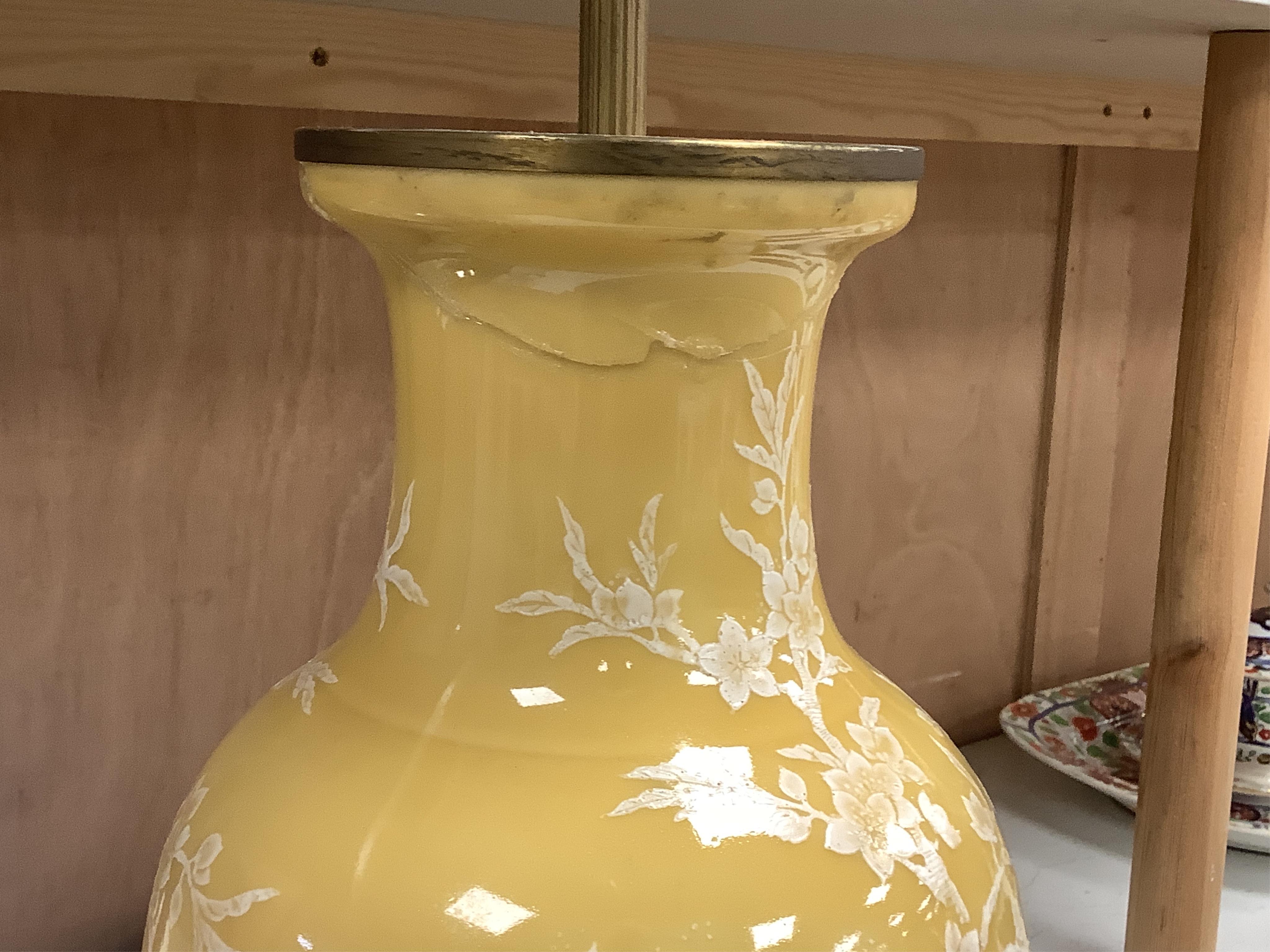 A garniture of three Chinese yellow ground lamp bases, pair 40cm high. Condition - fair